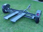 New Heavy Duty Tow Dolly with Hydraulic Surge Brakes, 14" Tires, Turntable, Ratchets and Tie-Down Straps